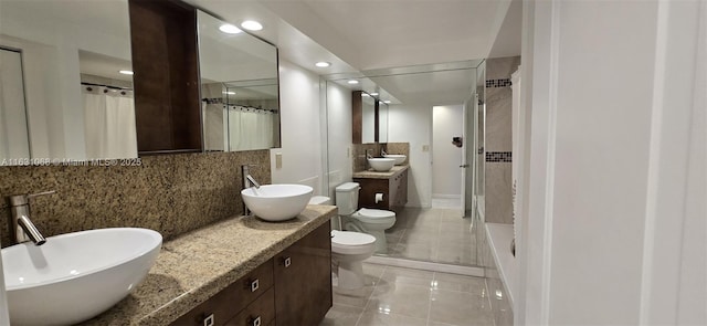 full bathroom featuring shower / tub combo with curtain, tasteful backsplash, tile patterned flooring, vanity, and toilet