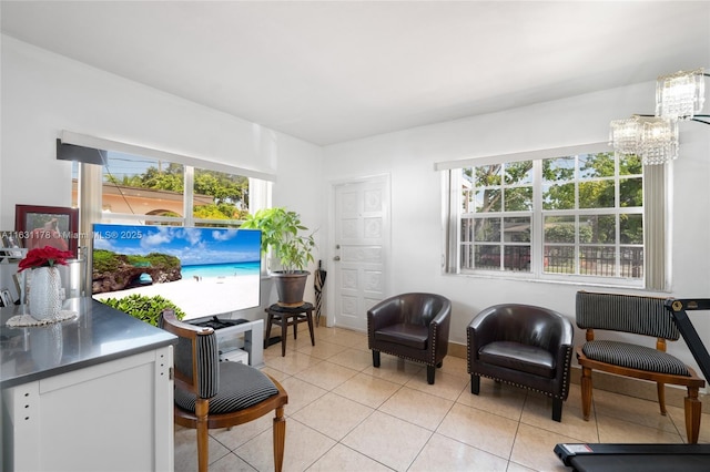 2901 SW 21st St, Miami, FL 33145 - living area featuring plenty of natural light, light tile patterned floors, and a chandelier