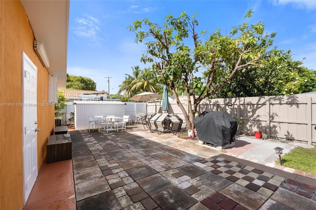 2901 SW 21st St, Miami, FL 33145 - fenced backyard featuring outdoor dining space, area for grilling, and a patio area