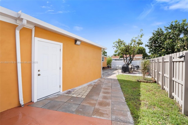 exterior space featuring a yard and a patio