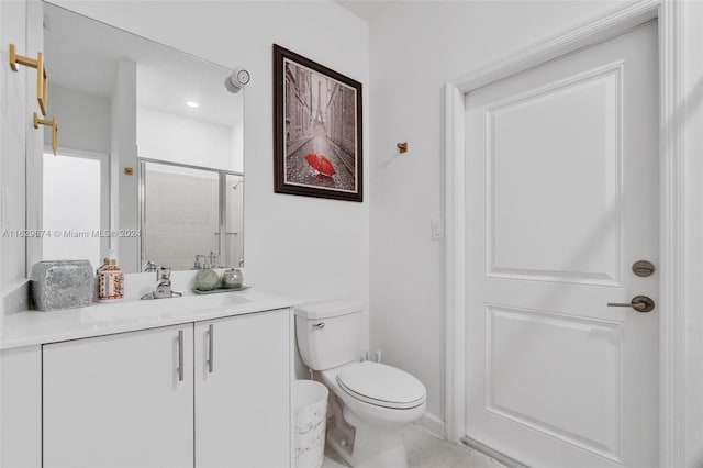 bathroom with tile patterned floors, vanity, and toilet