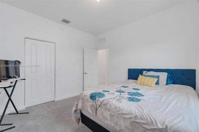 carpeted bedroom with a closet