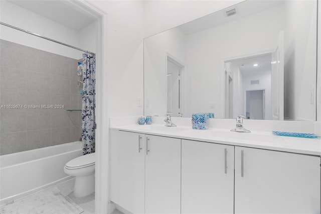 full bathroom featuring tile patterned floors, dual bowl vanity, toilet, and shower / tub combo with curtain