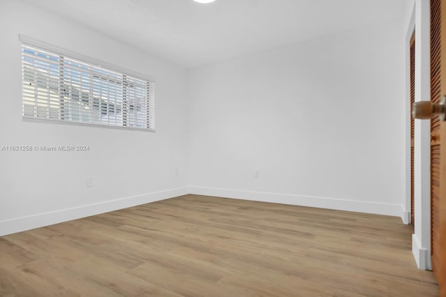 spare room with light wood-type flooring