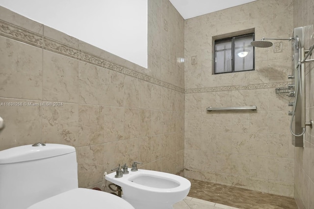 bathroom with tile walls, tiled shower, toilet, and a bidet