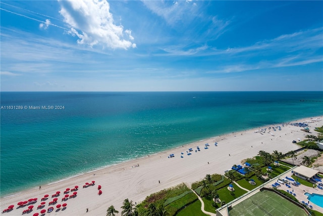 drone / aerial view with a view of the beach and a water view