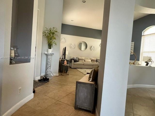 hallway with light tile patterned floors