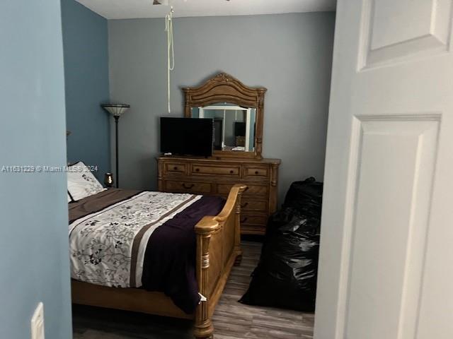 bedroom featuring hardwood / wood-style flooring