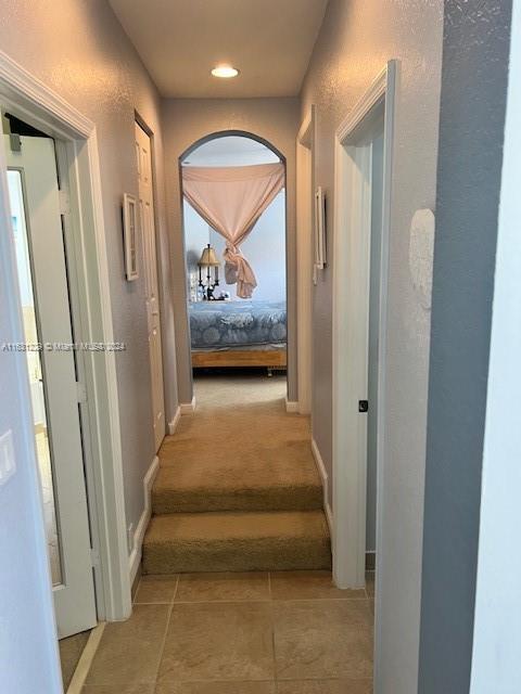 hallway with light tile patterned floors