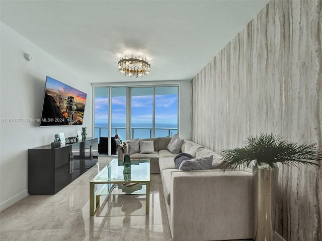 living room featuring an inviting chandelier and expansive windows