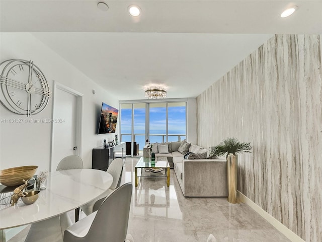 dining room with a wall of windows and light tile patterned flooring