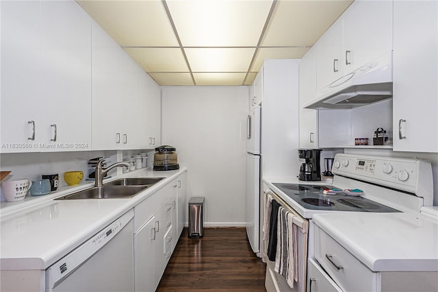 kitchen featuring white cabinetry, a drop ceiling, white appliances, dark wood-type flooring, and sink