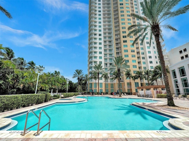 view of swimming pool featuring a patio area