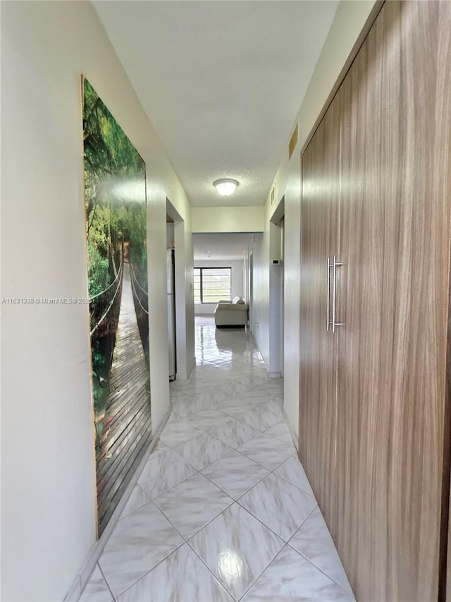 7480 NW 17th St Unit 305, Plantation, FL 33313 - hallway with light marble finish flooring