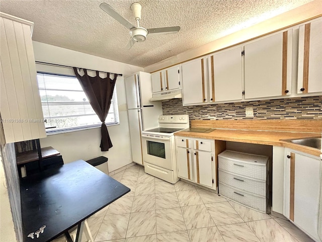 kitchen featuring decorative backsplash, white range with electric stovetop, white cabinetry, a textured ceiling, and ceiling fan