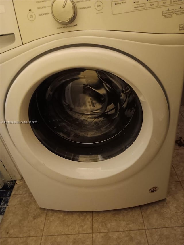 7480 NW 17th St Unit 305, Plantation, FL 33313 - washroom with washer / clothes dryer and tile patterned flooring