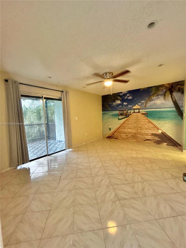 7480 NW 17th St Unit 305, Plantation, FL 33313 - spare room with a textured ceiling and ceiling fan