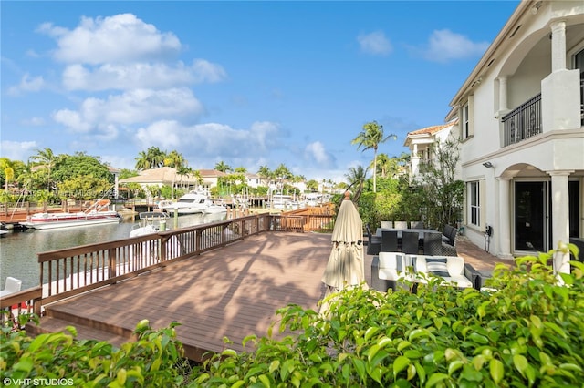 exterior space featuring an outdoor hangout area and a water view