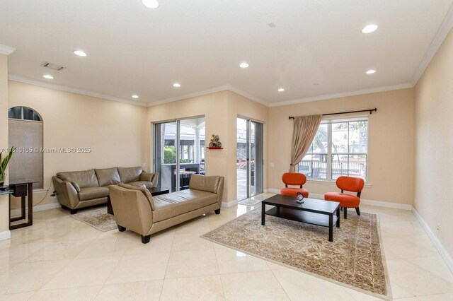 living room featuring ornamental molding and plenty of natural light