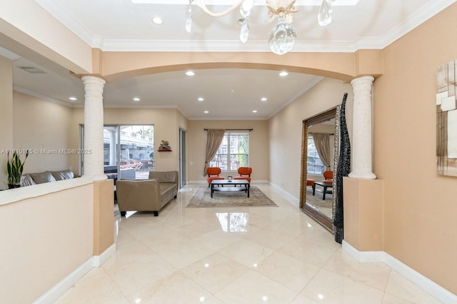 interior space with decorative columns and crown molding