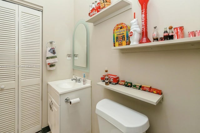 bathroom with vanity and toilet