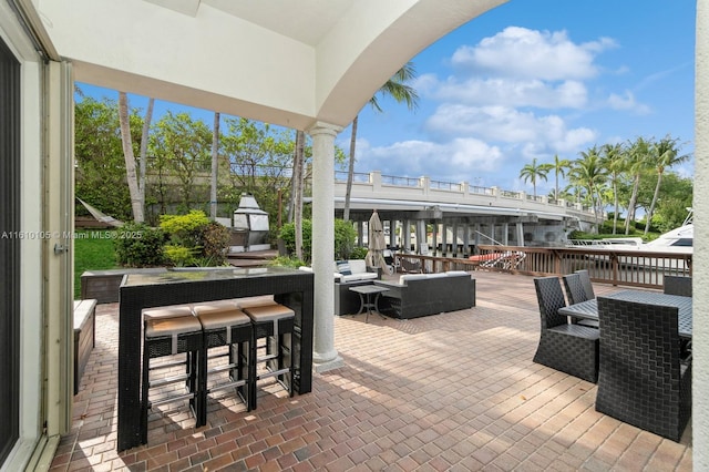 view of patio with an outdoor hangout area and an outdoor bar