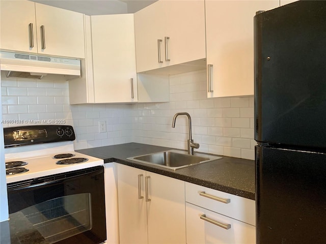 kitchen featuring decorative backsplash, black fridge, white cabinetry, and range with electric cooktop