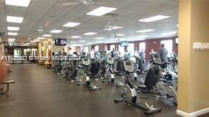 gym with a paneled ceiling