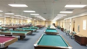 recreation room with a paneled ceiling and pool table