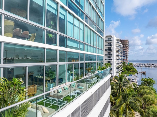 balcony featuring a water view