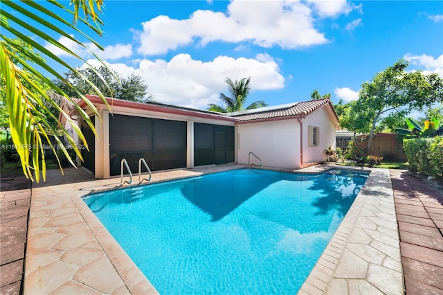 view of swimming pool featuring a patio