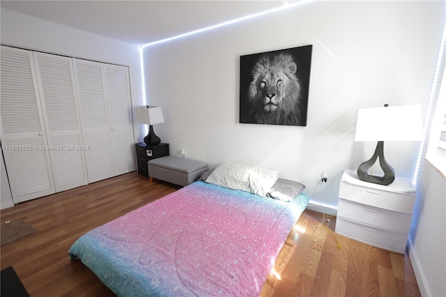 bedroom featuring hardwood / wood-style flooring and a closet