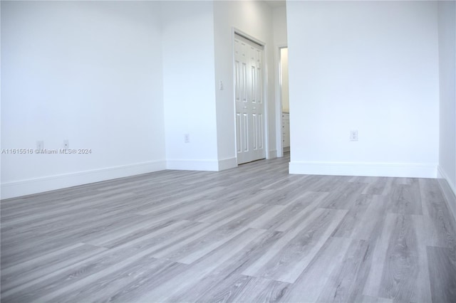 spare room with hardwood / wood-style floors