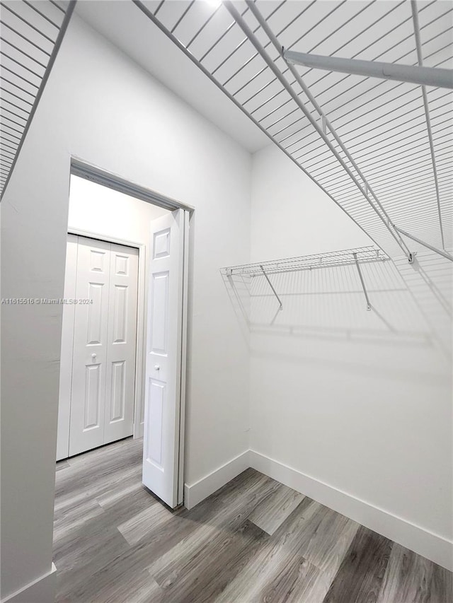 walk in closet featuring hardwood / wood-style flooring