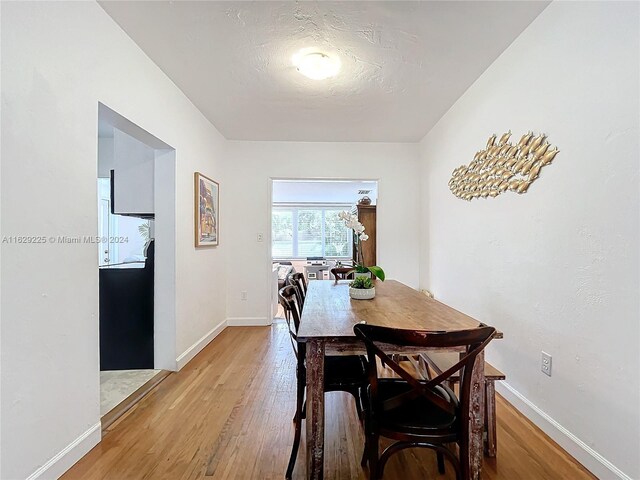 dining space featuring light hardwood / wood-style floors