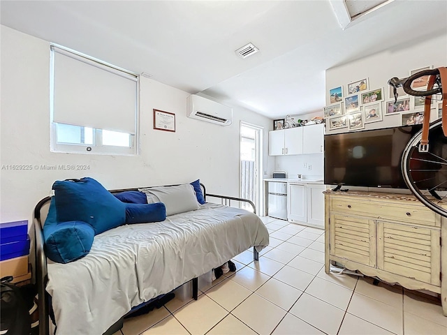 tiled bedroom featuring an AC wall unit and fridge