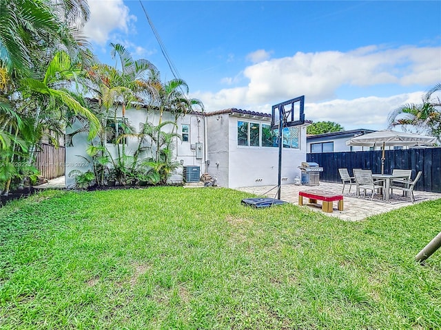 view of yard with a patio area and central AC