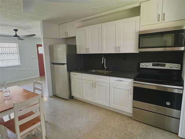 kitchen with white cabinetry, appliances with stainless steel finishes, and sink