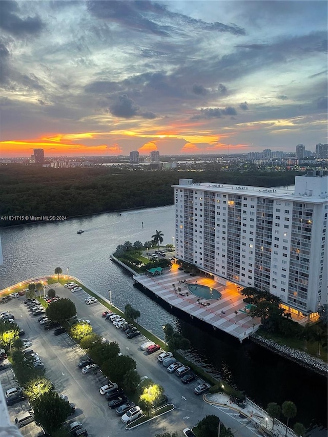 aerial view at dusk with a water view