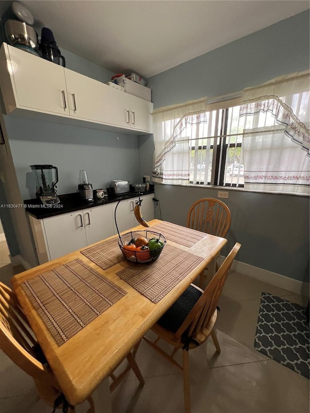 dining room with tile patterned floors