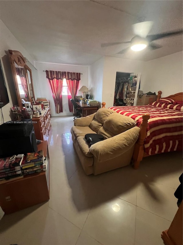 tiled living room with ceiling fan