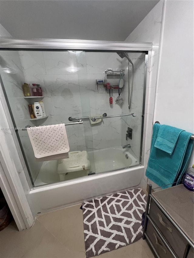 bathroom with tile patterned floors and enclosed tub / shower combo