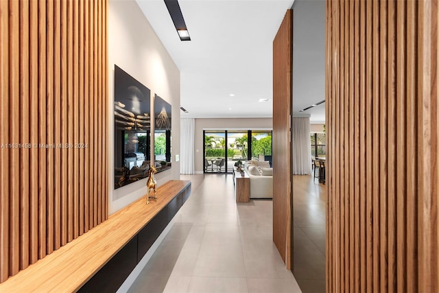 corridor featuring light tile patterned floors