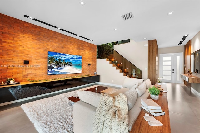 living room with brick wall