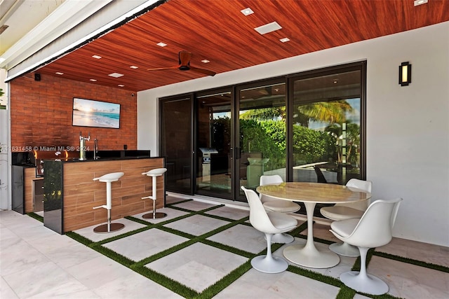 view of patio with sink and area for grilling