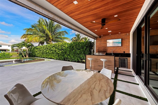 view of patio / terrace featuring ceiling fan