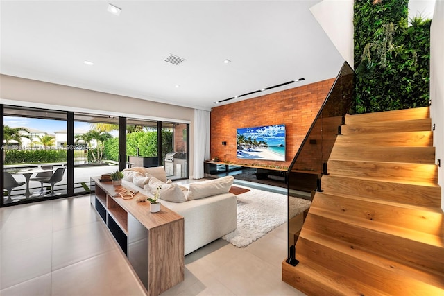 tiled living room featuring track lighting