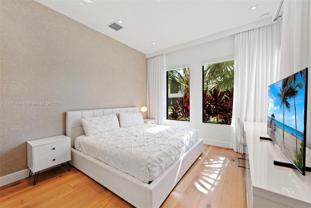 bedroom with light hardwood / wood-style floors