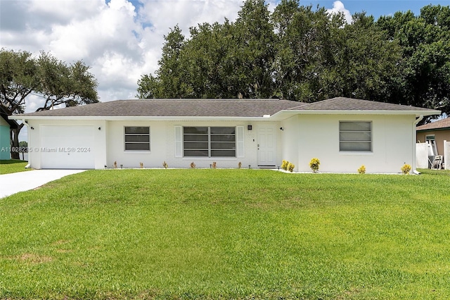 single story home featuring a front yard and a garage