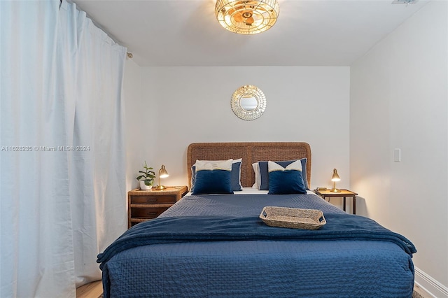 bedroom featuring wood-type flooring